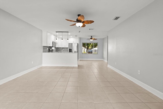11446 W Bayshore Dr Unit 36, Crystal River, FL 34429 - unfurnished living room featuring ceiling fan, light tile patterned floors, and recessed lighting