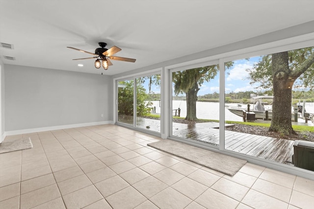 11446 W Bayshore Dr Unit 36, Crystal River, FL 34429 - tiled empty room with a water view, healthy amount of natural light, and ceiling fan