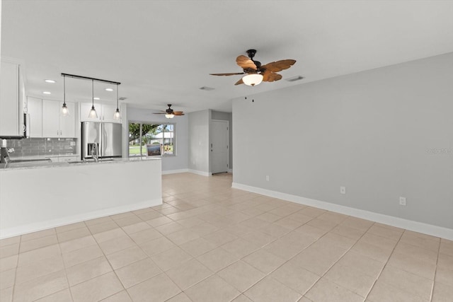 11446 W Bayshore Dr Unit 36, Crystal River, FL 34429 - unfurnished living room with a ceiling fan, recessed lighting, and light tile patterned flooring