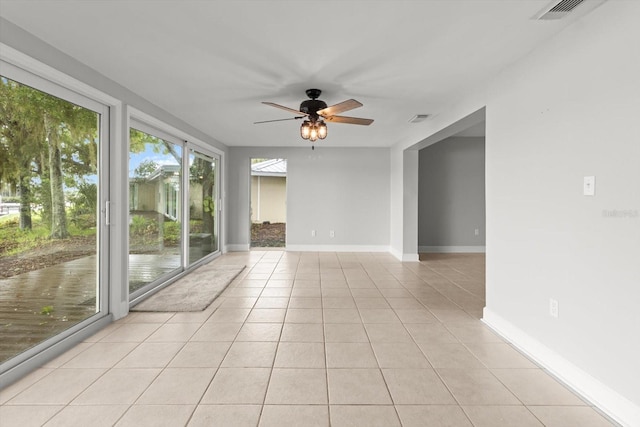 11446 W Bayshore Dr Unit 36, Crystal River, FL 34429 - spare room with a ceiling fan and light tile patterned floors