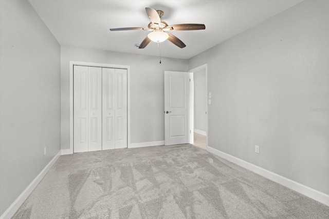 11446 W Bayshore Dr Unit 36, Crystal River, FL 34429 - unfurnished bedroom with a closet, carpet flooring, and a ceiling fan