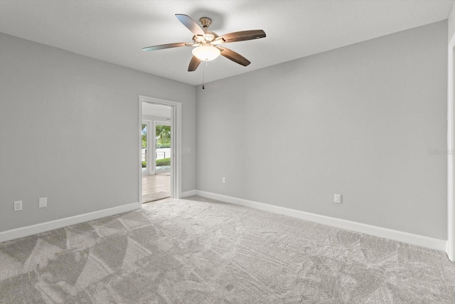 11446 W Bayshore Dr Unit 36, Crystal River, FL 34429 - spare room featuring ceiling fan and light colored carpet