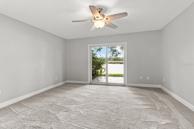 11446 W Bayshore Dr Unit 36, Crystal River, FL 34429 - unfurnished room with a ceiling fan, carpet flooring, and a water view