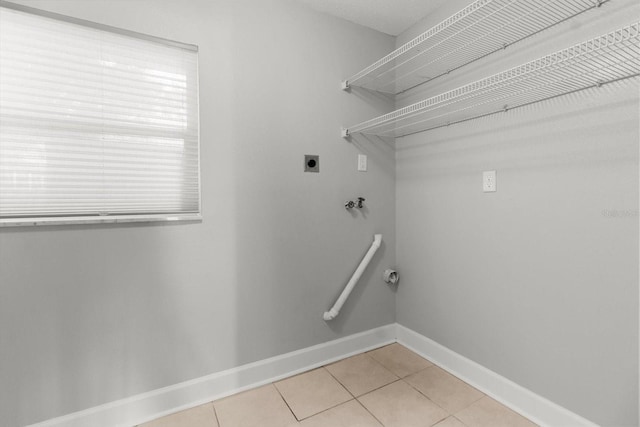 11446 W Bayshore Dr Unit 36, Crystal River, FL 34429 - washroom featuring hookup for an electric dryer, light tile patterned flooring, and washer hookup