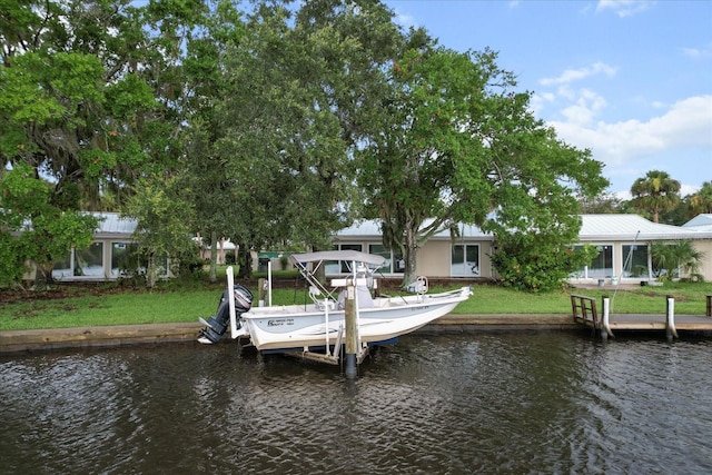 11446 W Bayshore Dr Unit 36, Crystal River, FL 34429 - dock area with a water view, boat lift, and a lawn