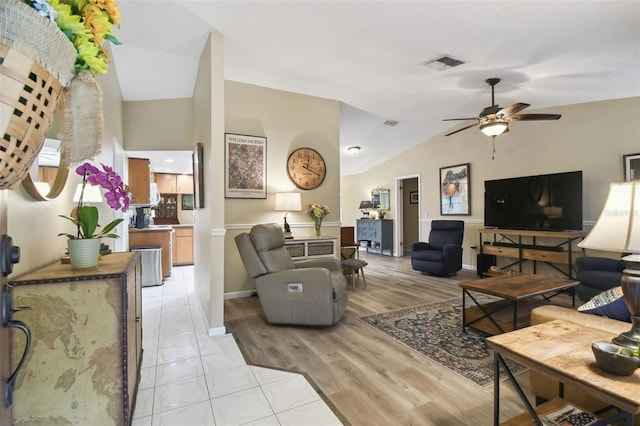 18531 Ozark Dr, Hudson, FL 34667 - living area with vaulted ceiling, ceiling fan, and light wood finished floors
