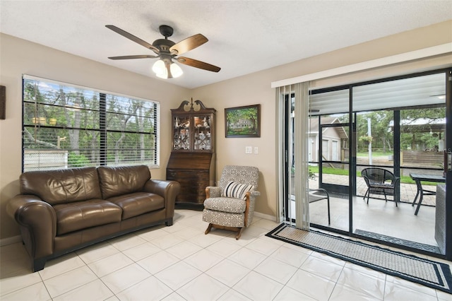 18531 Ozark Dr, Hudson, FL 34667 - living room featuring ceiling fan and light tile patterned floors