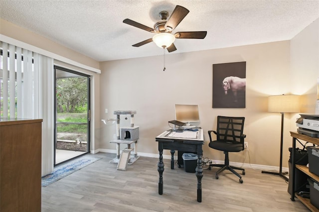 18531 Ozark Dr, Hudson, FL 34667 - office space with wood finished floors, ceiling fan, and a textured ceiling
