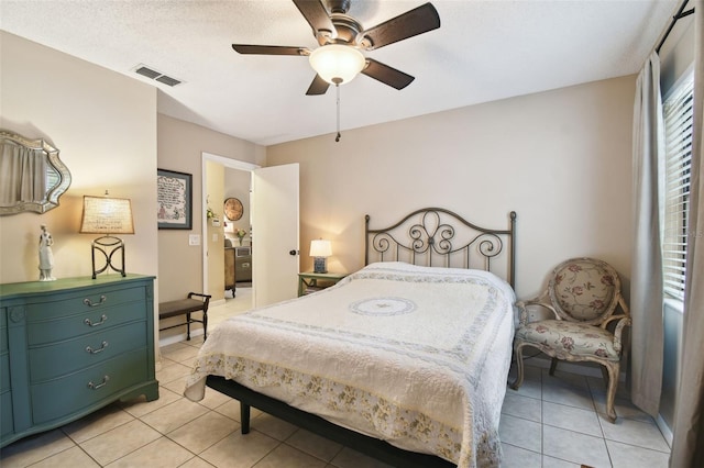 18531 Ozark Dr, Hudson, FL 34667 - bedroom with light tile patterned floors and a ceiling fan