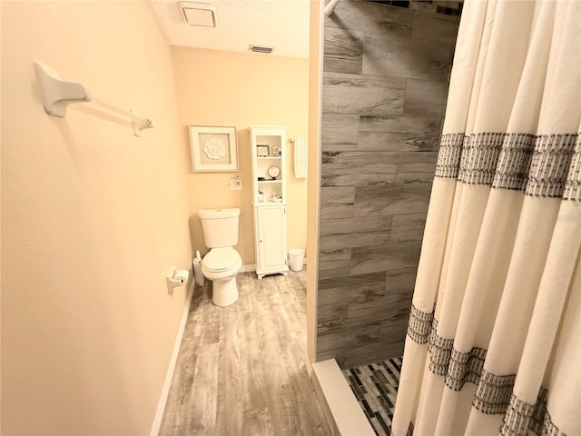 18531 Ozark Dr, Hudson, FL 34667 - bathroom with a stall shower and wood finished floors