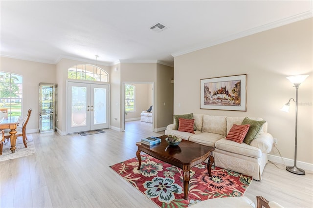 5301 Legend Hills Ln, Spring Hill, FL 34609 - living area with light wood-type flooring, crown molding, and french doors