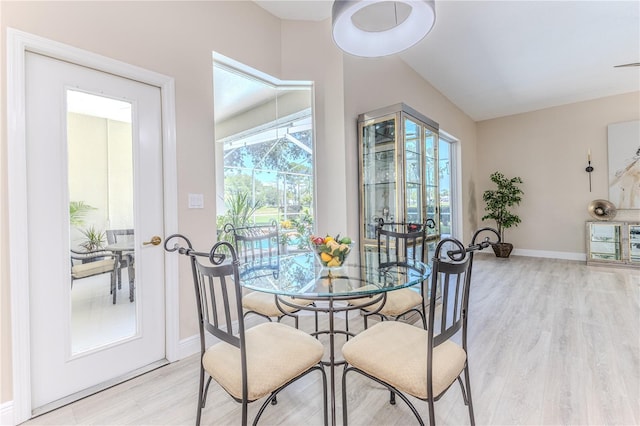5301 Legend Hills Ln, Spring Hill, FL 34609 - dining space featuring light wood finished floors and baseboards