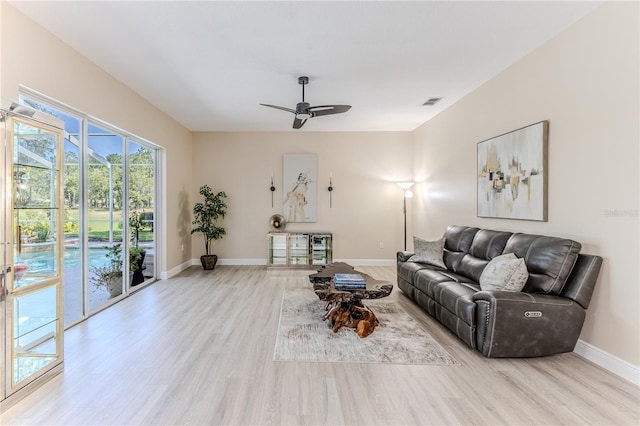 5301 Legend Hills Ln, Spring Hill, FL 34609 - living area featuring wood finished floors and a ceiling fan