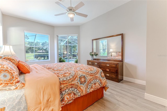 5301 Legend Hills Ln, Spring Hill, FL 34609 - bedroom with access to exterior, light wood finished floors, and a ceiling fan