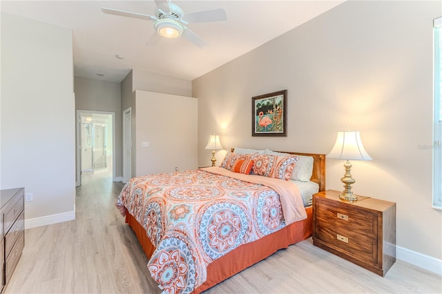 5301 Legend Hills Ln, Spring Hill, FL 34609 - bedroom with light wood-style floors, connected bathroom, and a ceiling fan