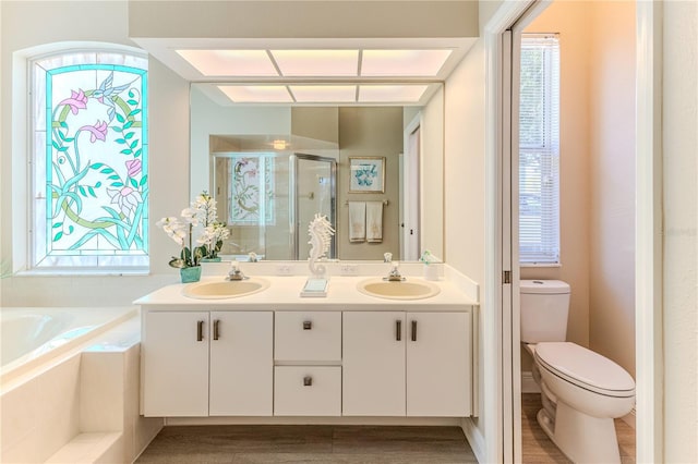 5301 Legend Hills Ln, Spring Hill, FL 34609 - bathroom with a shower stall, double vanity, and a garden tub