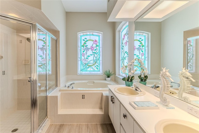 5301 Legend Hills Ln, Spring Hill, FL 34609 - full bath featuring a bath, healthy amount of natural light, double vanity, and a shower stall