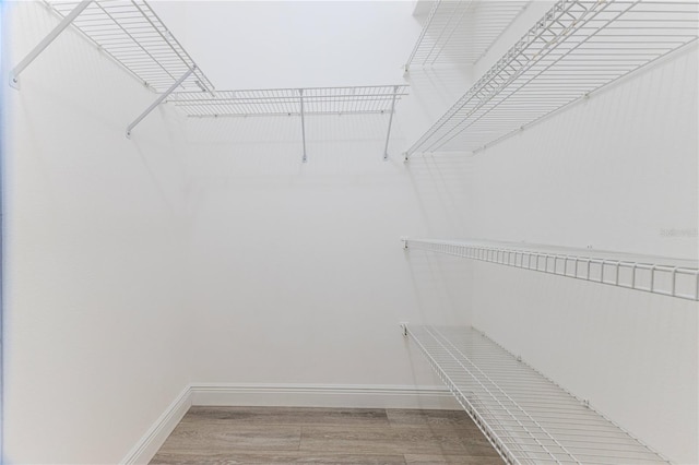 5301 Legend Hills Ln, Spring Hill, FL 34609 - walk in closet featuring wood finished floors