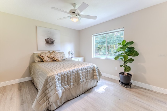 5301 Legend Hills Ln, Spring Hill, FL 34609 - bedroom with light wood-style flooring and a ceiling fan