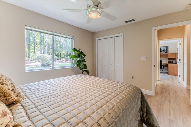 5301 Legend Hills Ln, Spring Hill, FL 34609 - bedroom with light wood-type flooring, a closet, and ceiling fan