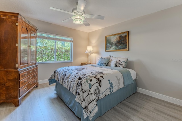 5301 Legend Hills Ln, Spring Hill, FL 34609 - bedroom featuring light wood finished floors and ceiling fan
