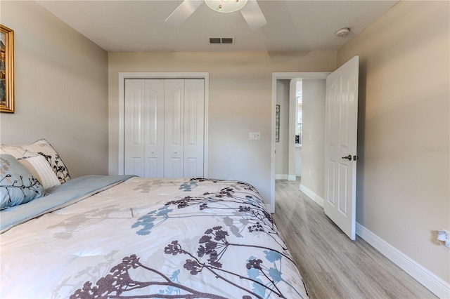 5301 Legend Hills Ln, Spring Hill, FL 34609 - bedroom with light wood-type flooring, a closet, and a ceiling fan