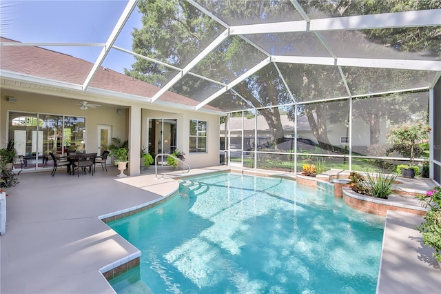 5301 Legend Hills Ln, Spring Hill, FL 34609 - outdoor pool featuring a patio, a ceiling fan, and glass enclosure