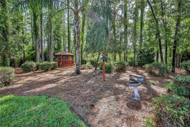 5301 Legend Hills Ln, Spring Hill, FL 34609 - view of yard featuring a gazebo and a wooded view