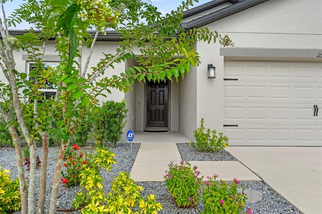 12948 Conquistador Loop, Spring Hill, FL 34610 - property entrance with stucco siding and an attached garage