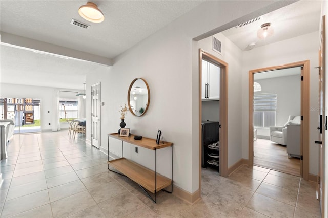 12948 Conquistador Loop, Spring Hill, FL 34610 - hall with light tile patterned floors and baseboards