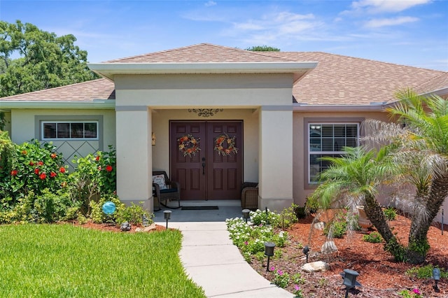9863 Deer St, Spring Hill, FL 34608 - entrance to property with roof with shingles and stucco siding