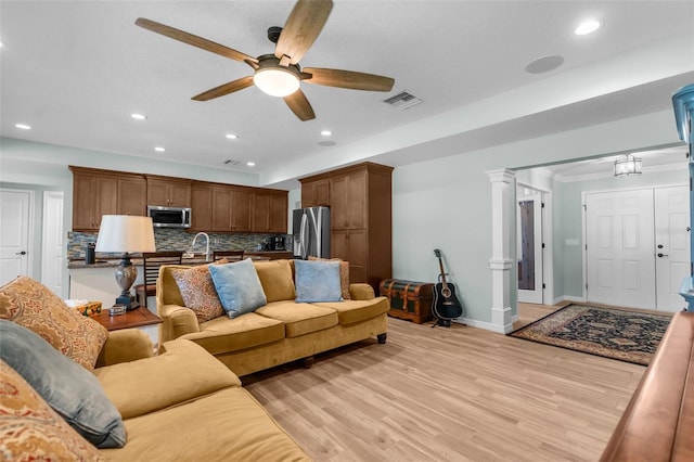 9863 Deer St, Spring Hill, FL 34608 - living area with recessed lighting, ceiling fan, light wood-style flooring, and ornate columns