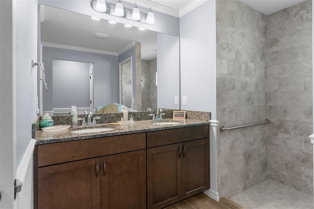 9863 Deer St, Spring Hill, FL 34608 - full bath with double vanity, a walk in shower, crown molding, and wood finished floors