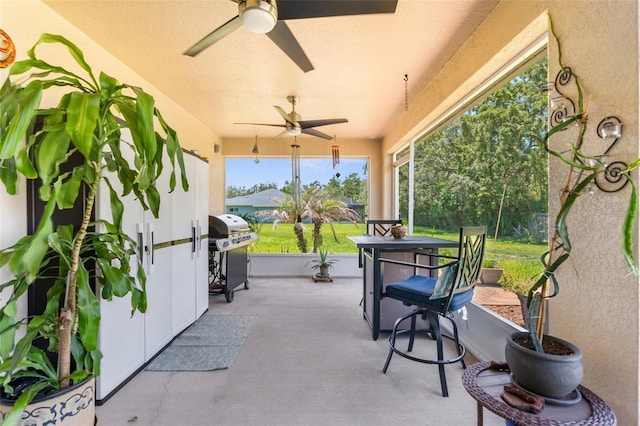 9863 Deer St, Spring Hill, FL 34608 - view of patio / terrace featuring a ceiling fan, area for grilling, and outdoor dining space