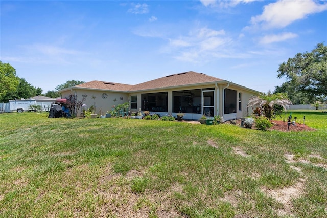 9863 Deer St, Spring Hill, FL 34608 - rear view of house with a sunroom, a yard, and stucco siding