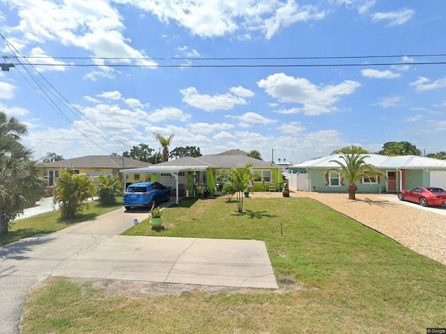 6424 Boatyard Dr, Hudson, FL 34667 - ranch-style house with a front yard and driveway