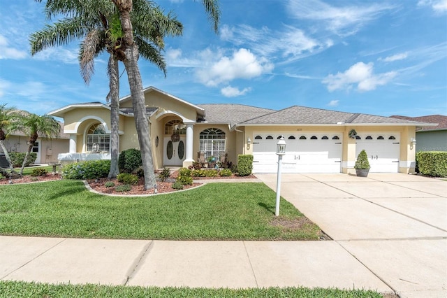 1610 Winding Willow Dr, Trinity, FL 34655 - single story home featuring stucco siding, an attached garage, driveway, and a front lawn