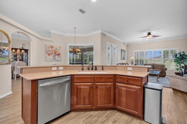 1610 Winding Willow Dr, Trinity, FL 34655 - kitchen featuring stainless steel dishwasher, a chandelier, open floor plan, light wood-style flooring, and ornamental molding