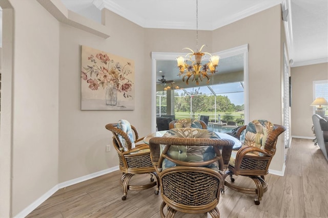 1610 Winding Willow Dr, Trinity, FL 34655 - dining area with a sunroom, crown molding, light wood finished floors, and a chandelier