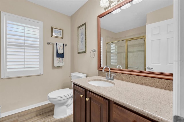 1610 Winding Willow Dr, Trinity, FL 34655 - bathroom with a stall shower, vanity, and wood finished floors
