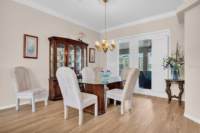 1610 Winding Willow Dr, Trinity, FL 34655 - dining space featuring ornamental molding, light wood finished floors, a chandelier, and french doors