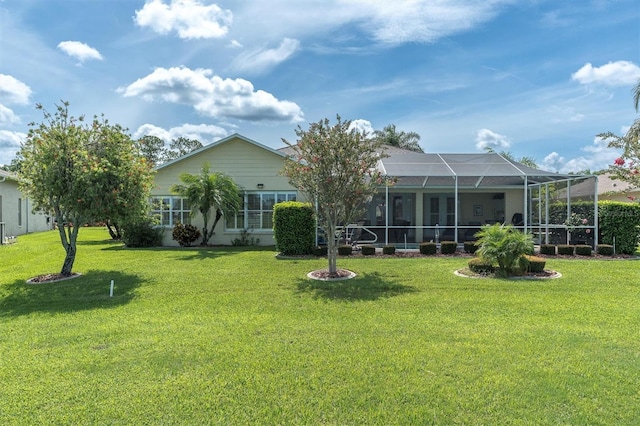 1610 Winding Willow Dr, Trinity, FL 34655 - back of property with a lawn and glass enclosure