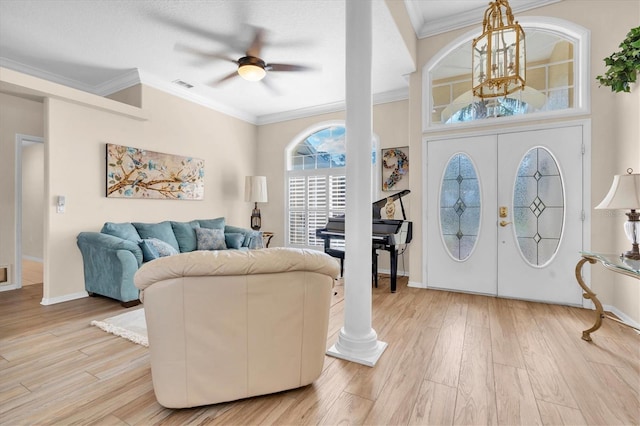 1610 Winding Willow Dr, Trinity, FL 34655 - entrance foyer featuring a ceiling fan, light wood-type flooring, crown molding, and french doors