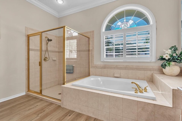 1610 Winding Willow Dr, Trinity, FL 34655 - full bath featuring a bath, a shower stall, wood finished floors, and ornamental molding