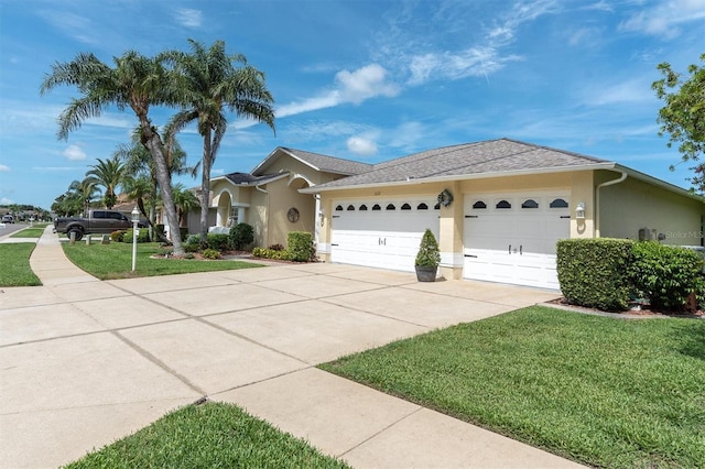 1610 Winding Willow Dr, Trinity, FL 34655 - single story home with a garage, stucco siding, driveway, and a front yard
