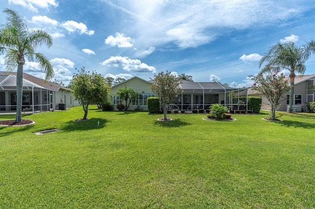1610 Winding Willow Dr, Trinity, FL 34655 - view of grassy yard featuring a lanai