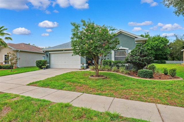 15604 Durango Cir, Brooksville, FL 34604 - view of front of house featuring concrete driveway, an attached garage, stucco siding, and a front lawn