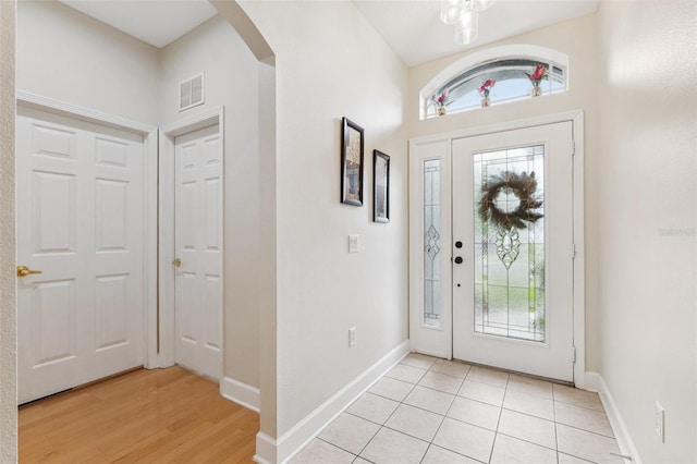 15604 Durango Cir, Brooksville, FL 34604 - foyer featuring arched walkways and light wood-style flooring