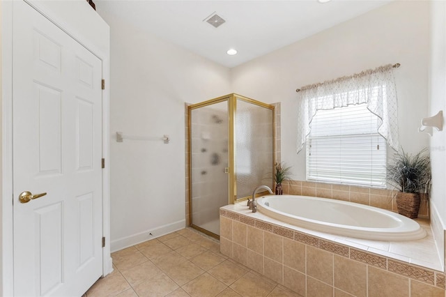 15604 Durango Cir, Brooksville, FL 34604 - full bath with a shower stall, a bath, and tile patterned flooring