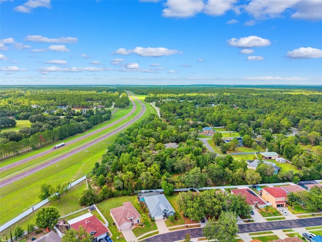 15604 Durango Cir, Brooksville, FL 34604 - aerial view of residential area featuring a heavily wooded area